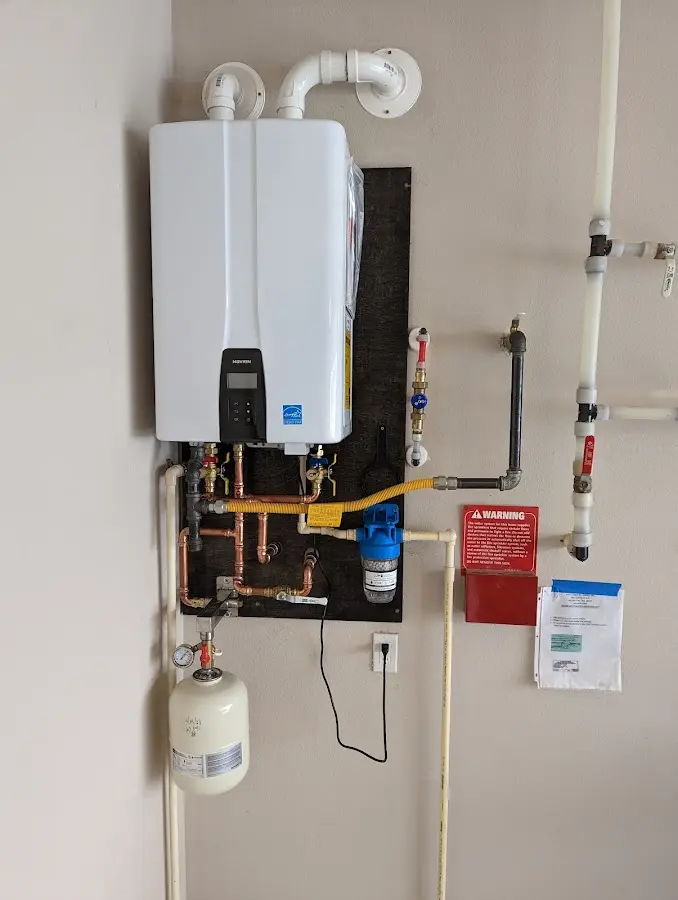 Professional plumber installing copper piping in a Indiantown home